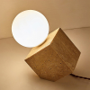 Настольная лампа Cube Stone — цвет желтый, из материала жовтий травертин, скло, стиль модерн