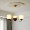 Люстра Aurorium — цвет ореха і золото, из материала  метал, дерево, стиль модерн