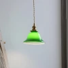 Зеленый подвесной светильник Bell — из материала метал, латунь, стиль модерн