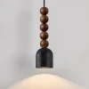 Підвісний світильник Vareon Totem — колір горіха і чорний, з матеріалу  чорний травертин, метал, стиль модерн